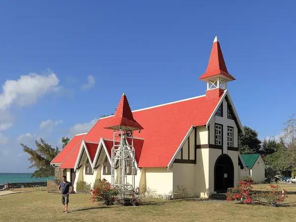 The red-roofed Notre Dame Auxiliatrice church at Cap Malheureux