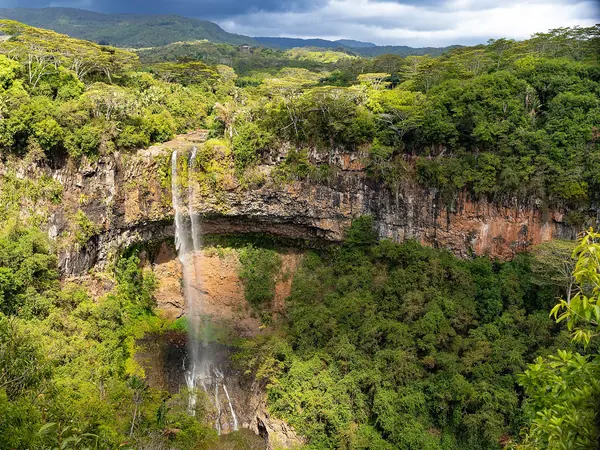 The Chamarel waterfall falling into dense forest